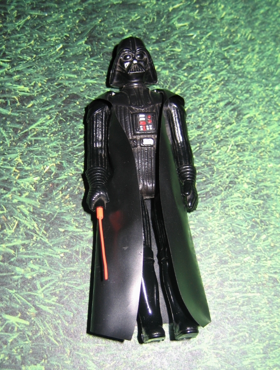 darth vader with green lightsaber toy